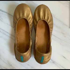 Gold tieks in gently used condition.